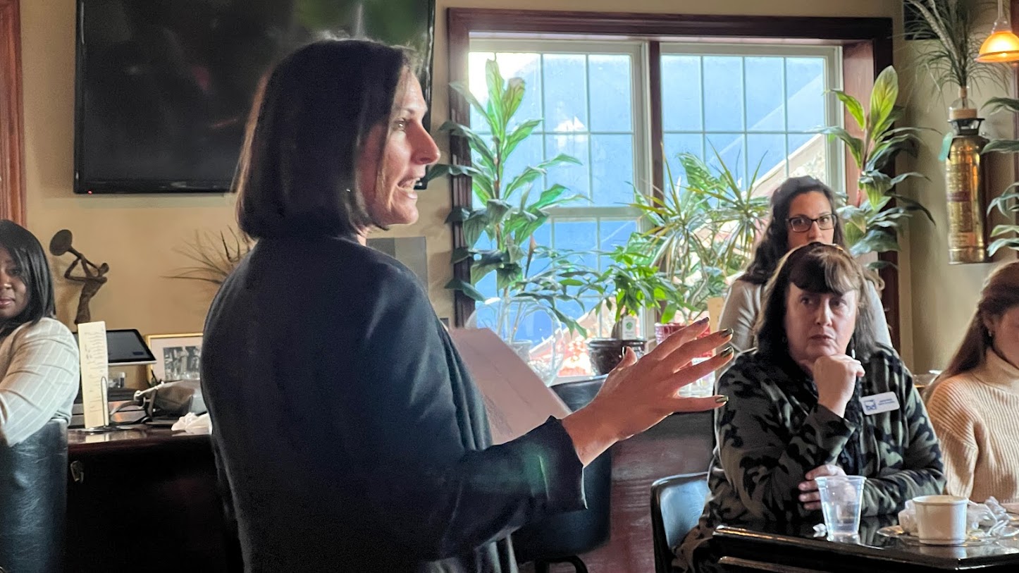 Stephanie Smith speaks to a group of women